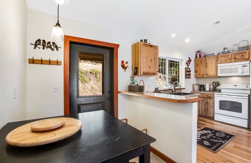 Ronald House | Custom home with balcony, radiant floor heating & washer/dryer