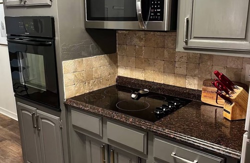 South Tulsa Condo | Darling 3-bedroom Duplex with Gameroom!