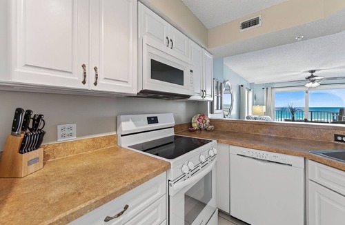 Seawinds Condo Condo | Direct oceanfront 2/2 corner condo with large balcony, heated pool, and garage parking