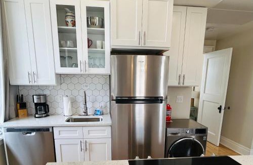 Boise Apartment | Downtown Digs-View of the City! Stay above local restaurants and nightlife, posh amenities heated toilet seat, oversized rain shower head in glass shower, in-unit laundry, one garage parking spot