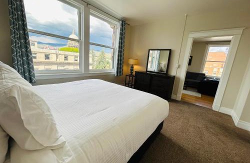 Boise Apartment | Downtown Digs-View of the City! Stay above local restaurants and nightlife, posh amenities heated toilet seat, oversized rain shower head in glass shower, in-unit laundry, one garage parking spot