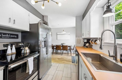Garden District House | Downtown mid-century home with pet friendly, fenced yard. Sleeps 7