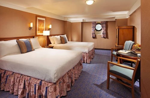 Harbor Hotel | Escape to a Classic Stateroom on an Iconic Ocean Liner with Dining | 3 Rooms