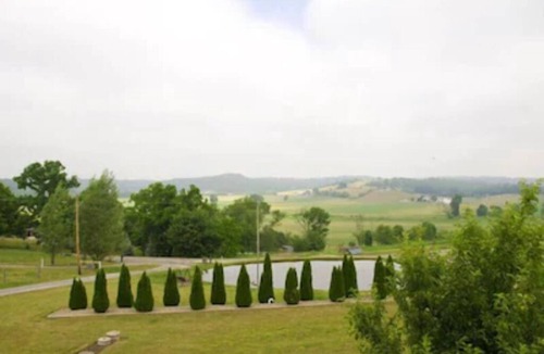 Dundee Cottage | Escape to our romantic stone cottage by a pond overlooking Amish country