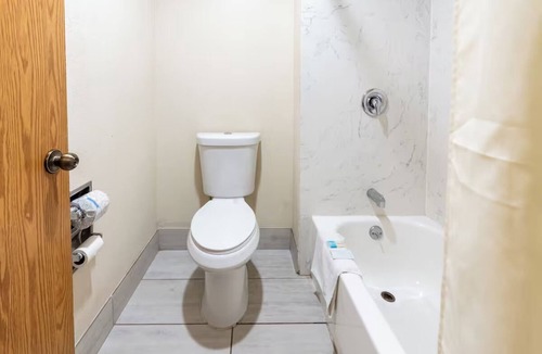 Corcoran Hotel | Essential Comforts in a Clean Room Near Transit & Local Dining Hotspots