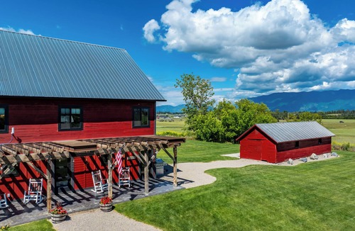 Kalispell House | Exclusive Guest Ranch with 13 bedrooms, Train Caboose and Hot Tub Lookout!
