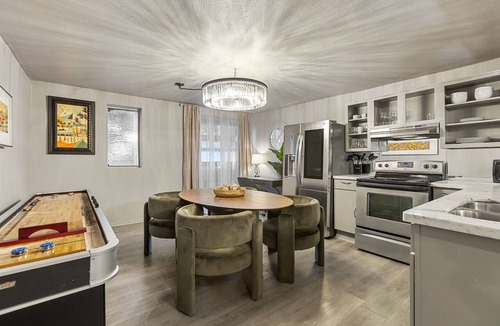 Old East Dallas Condo | Experience elevated living in this executive 2-bed, 1.5-bath furnished condo featuring a private garden-view patio. Enjoy resort-style amenities including a pool, sauna, cold plunge, and outdoor fitness deck. Perfect for extended stays!