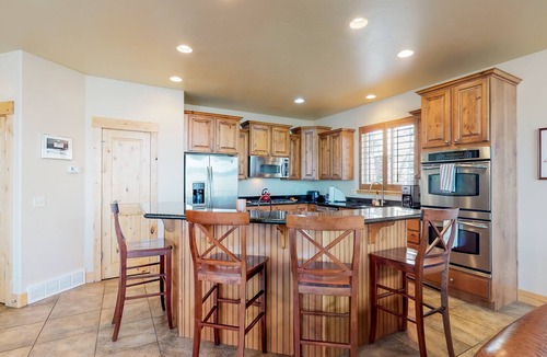 Bear Hollow Village House | Fantastic home with fireplace, private hot tub, central AC, and pool access