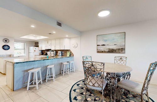 South Padre Island Condo | Fully Renovated Getaway with Beachfront Patio - Steps to Pool & Hot Tub