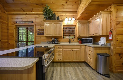 Broken Bow Cabin | Grandview ~ Riverfront with play set, hot tub, kayaks and outdoor patio