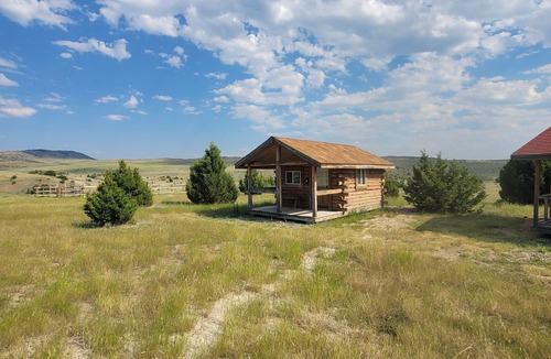 Manhattan Cabin | GRIZZLY ROCK RANCH Rustic Tiny Log Cabin Glamping and Horseback Riding Available