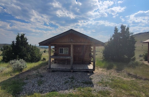 Manhattan Cabin | GRIZZLY ROCK RANCH Rustic Tiny Log Cabin Glamping and Horseback Riding Available