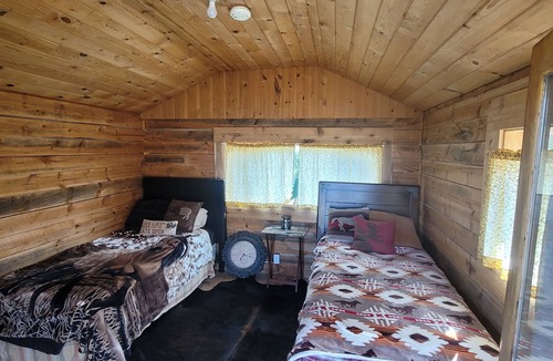 Manhattan Cabin | GRIZZLY ROCK RANCH Rustic Tiny Log Cabin Glamping and Horseback Riding Available
