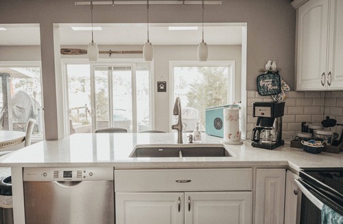 Portage Lakes Cottage | HEAVENLY Portage Lakes water front 4-bedroom cottage with HOTTUB, dog friendly!