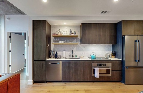 Rainey Street Historic District Condo | Historic Rainey St. condo with skyline views - rooftop pool & gym