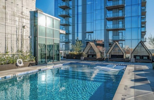 Rainey Street Historic District Condo | Historic Rainey St. condo with skyline views - rooftop pool & gym