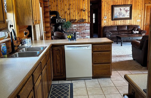 Seeley Lake Cabin | Immaculate log house with backyard view of pond, in Seeley!