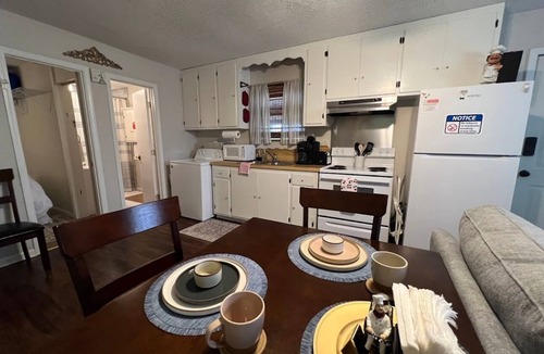 Lake Charles House | Indulge in stunning vistas from the porch, complemented by essential amenities for a cozy
