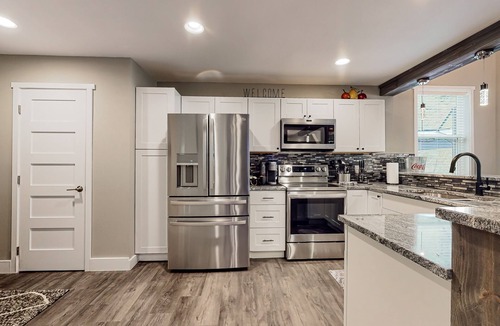 Mason County House | Inviting riverfront home with hot tub, firepit, W/D, & dog-friendly