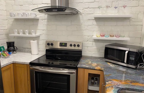 Downtown Greensboro Condo | King Bed and Huge Windows in the Heart of Downtown Greensboro