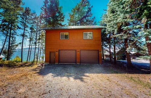 Woods Bay Cabin | Lakefront getaway with dock, 400- square-foot deck, close to town