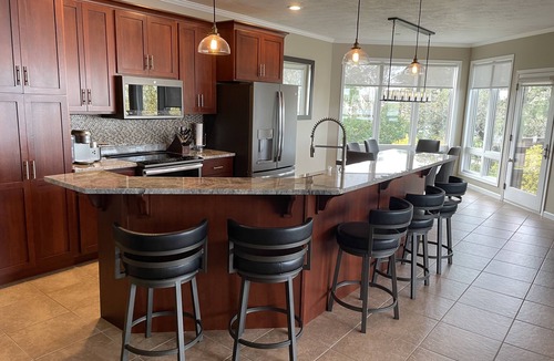 Arnolds Park Condo | Lakefront Luxury! Spacious corner condo, wrap around deck. 6 BB waterpark passes