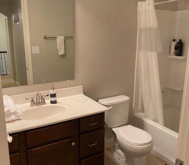 Maxwell House | Lakefront view private bedroom and bathroom with kitchen