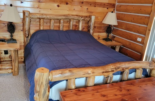 Hulett House | Large garage for bikes. Beautiful log home. On golf course.
