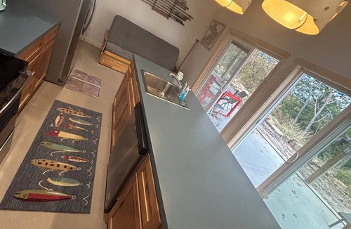 Mannford Apartment | Large porch offers beautiful views of the lake. Enjoy unique interior design!
