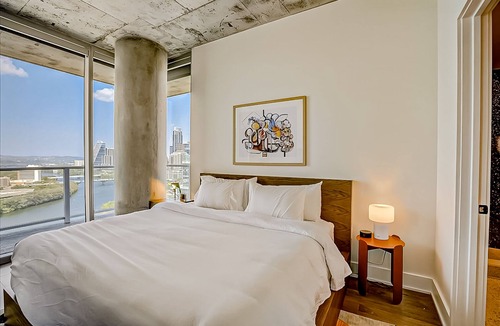 Rainey Street Historic District Condo | Luxe 24th flr condo w/wraparound lake-view balcony, rooftop pool, gym