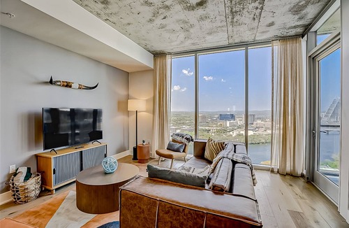 Rainey Street Historic District Condo | Luxe 24th flr condo w/wraparound lake-view balcony, rooftop pool, gym