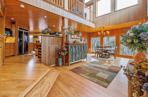 Three Rivers Ski Chalet | Majestic Riverfront Chalet is set down a serene and private drive.