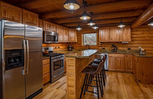 Meeteetse Cabin | Majestic Wyoming Landscape. Riverfront log cabin. Relax in or explore out!