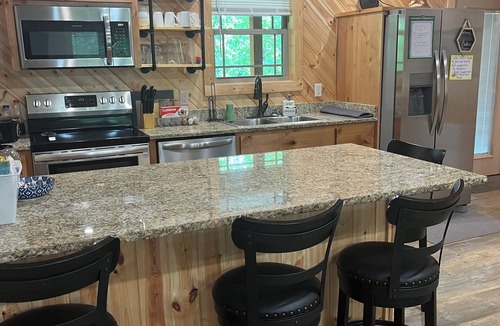 Carlisle Cabin | New Cabin on Private Lake with Hot Tub, Gas Grill, Fire Pit & Swings