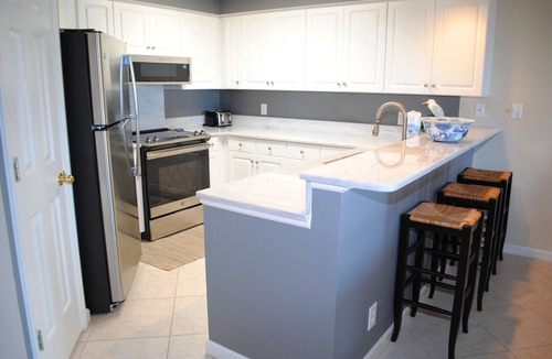 Litchfield by the Sea Condo | Oceanfront condo with private stairs from balcony and pool access in Litchfield By the Sea.