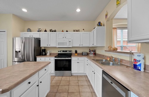 Solana House | Once Upon A Stay. Your tranquil spacious resort retreat w/outdoor kitchen & private pool near Disney
