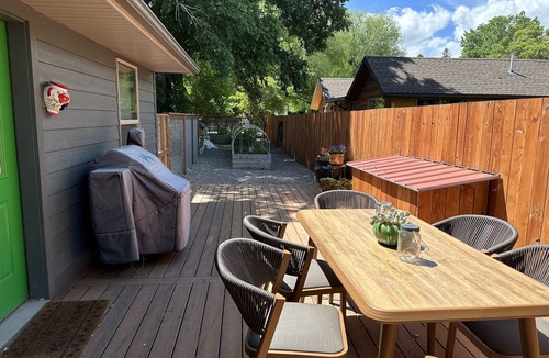 Ennis House | Pet friendly home with fenced yard, gardens and sauna one block from Main Street