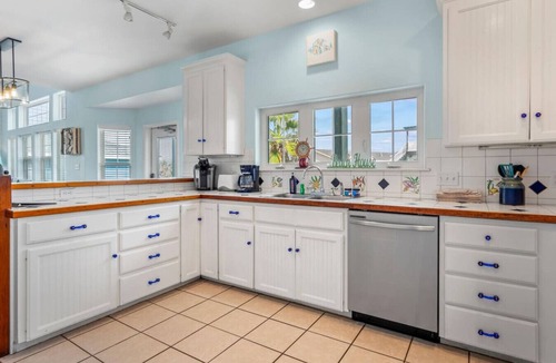 Sand Point House | "Prime coastal retreat just steps from the beach! Unwind by the community pool or ride the waves for the ultimate seaside escape."