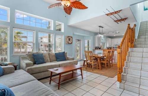 Sand Point House | "Prime coastal retreat just steps from the beach! Unwind by the community pool or ride the waves for the ultimate seaside escape."