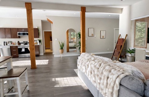 Otter Point Apartment | Private creekside retreat with sauna, fire pit & rain shower.