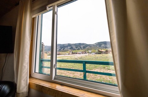 Centennial Apartment | Queen Suite in Historic Centennial Hotel
