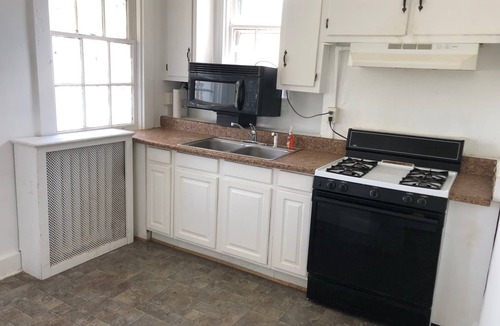 Mosby House | Relax in beautiful second floor apartment with balcony & private fenced yard.
