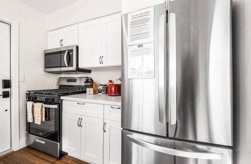 Crown Point House | Remodeled PB Homes w/Parking - AC - steps2beach - Sleeps 28 - 5 homes combined!