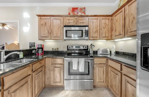 Gruene Condo | River view condo with a pool, washer/dryer, central AC - snowbirds welcome