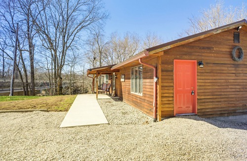 Covington Cottage | Riverfront Covington Cabin w/Deck & Fire Pit!