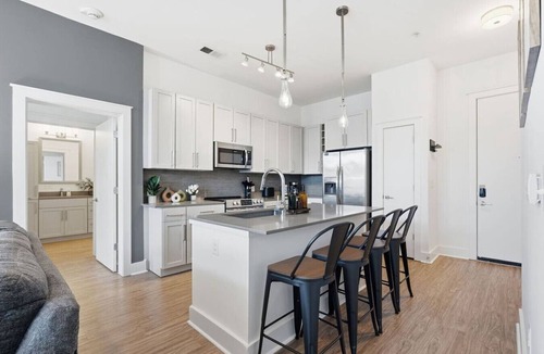Second Ward Apartment | Skyline Retreat - Free Parking, Pool, Balcony