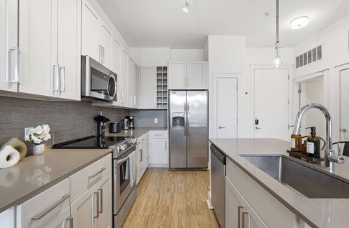 Second Ward Apartment | Skyline Retreat - Free Parking, Pool, Balcony