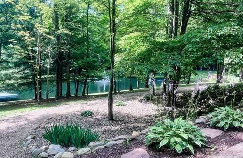 Loudonville House | Spacious, family-friendly lodge on 10 wooded acres. Sleeps 20 with 5 bedrooms, stocked pond