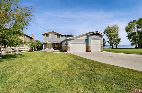 Garden City House | Spacious Waterfront Getaway with Private Hot Tub, Furnished Deck, and Game Room