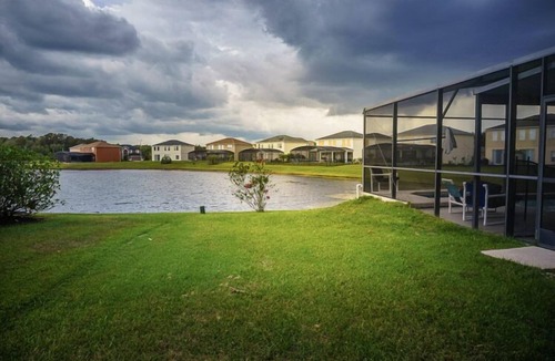 Crescent Lakes Villa | Sprawling Private Pool Home near Disney w/Pond Views & Game Room